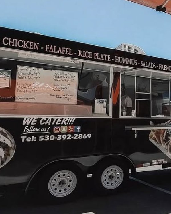 The Supreme Gyros truck serving at an event